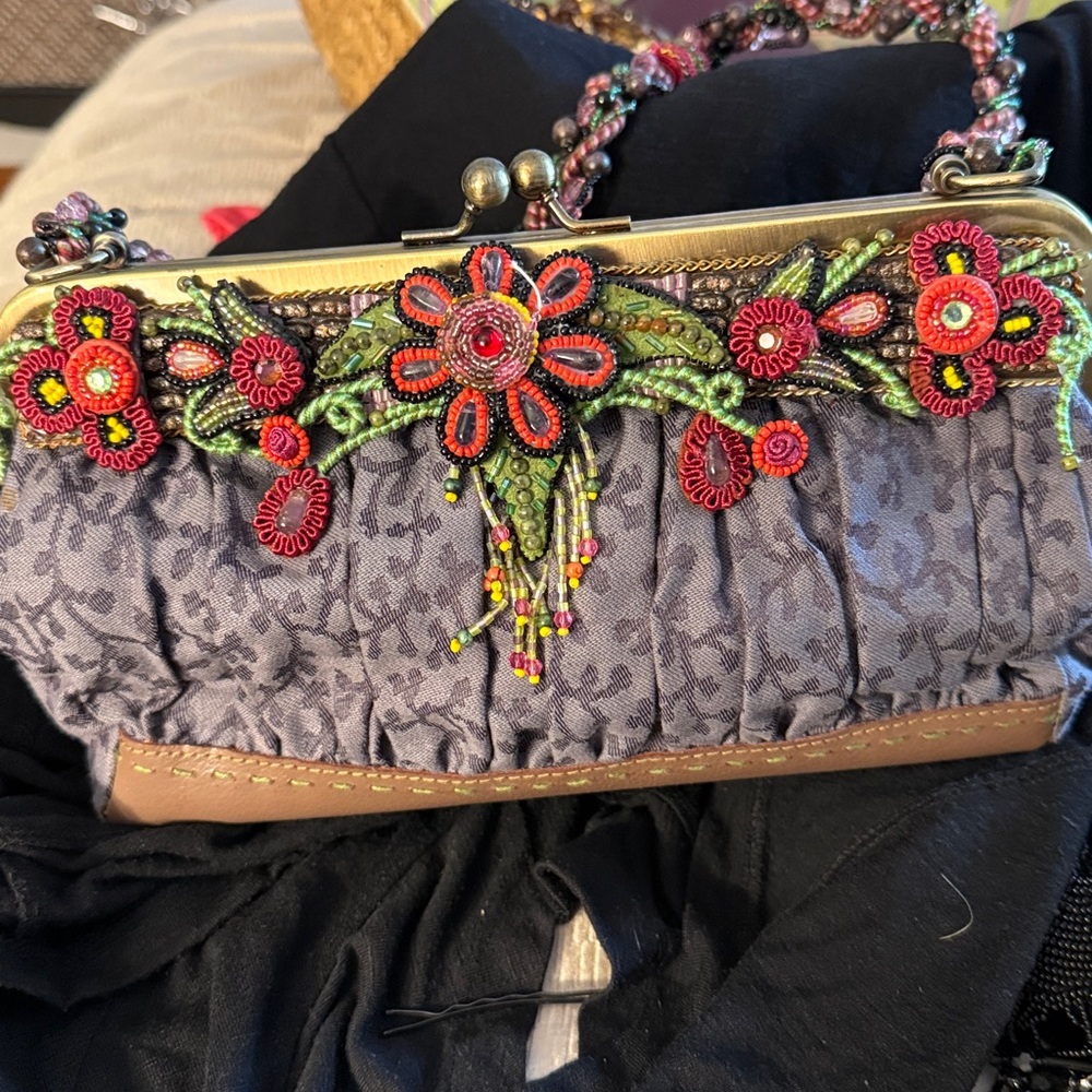 Mary Frances with beaded floral accents in red.
